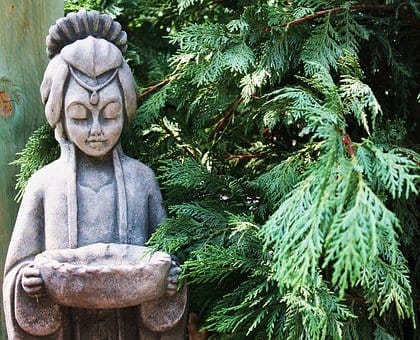 a garden statue made of natural stone